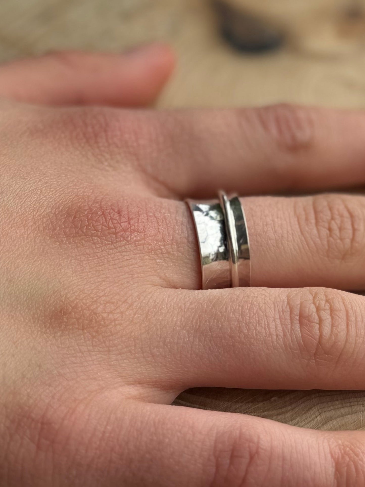 Hammered spinner ring on hand