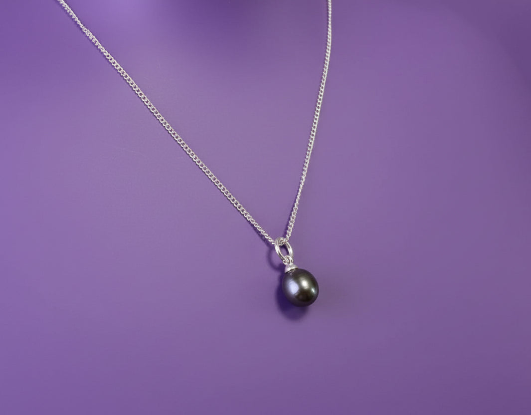 Dark pearl on purple background
