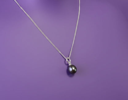 Dark pearl on purple background
