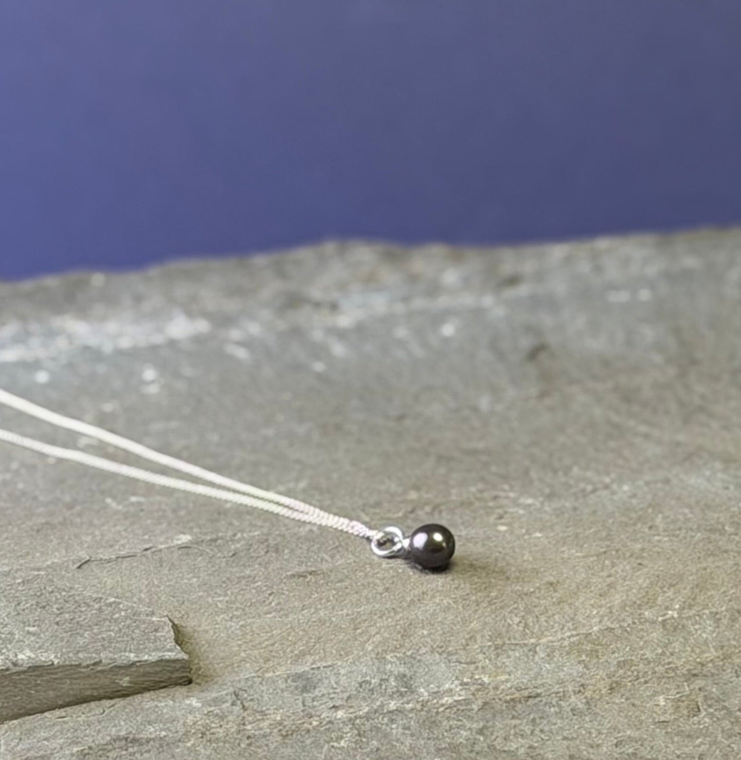 Dark pearl drop on fine curb chain
