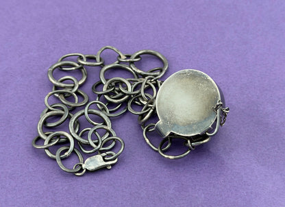 Back of piece showing hallmark and catch