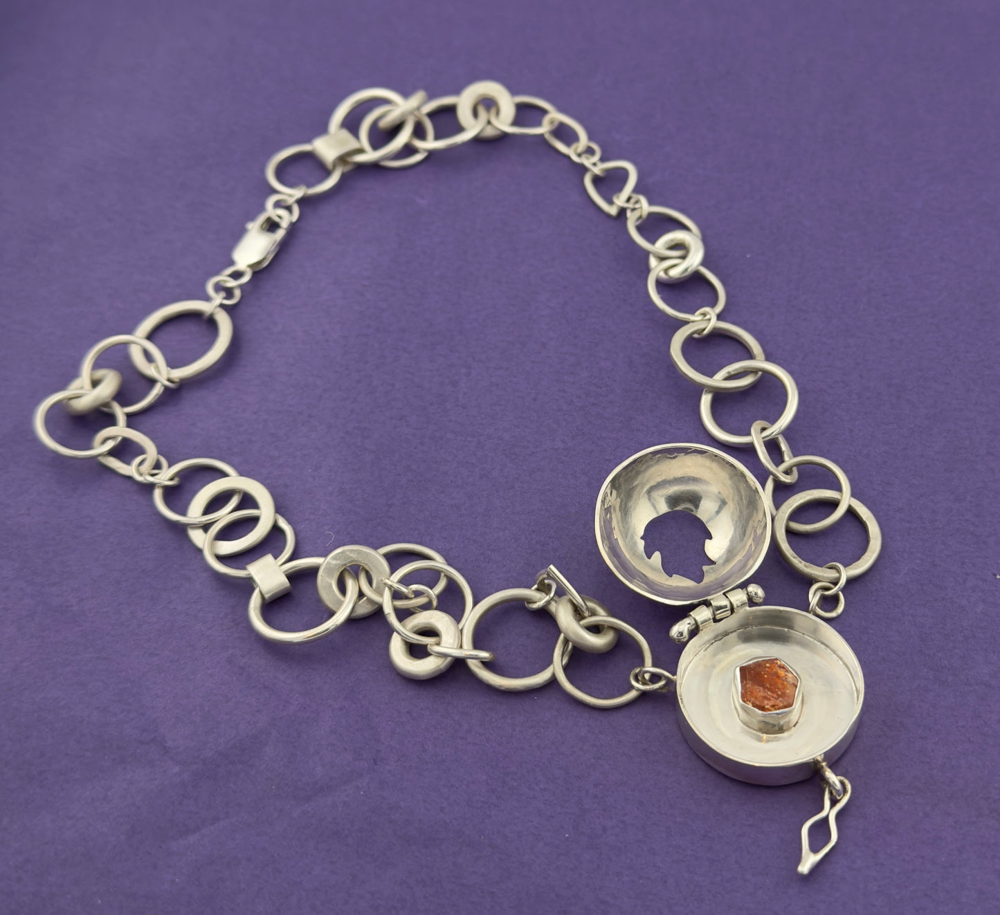 ‘The Fire Within’ necklace with flame cut out. Sun stone set