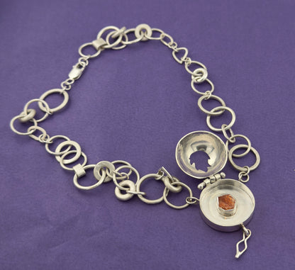 ‘The Fire Within’ necklace with flame cut out. Sun stone set