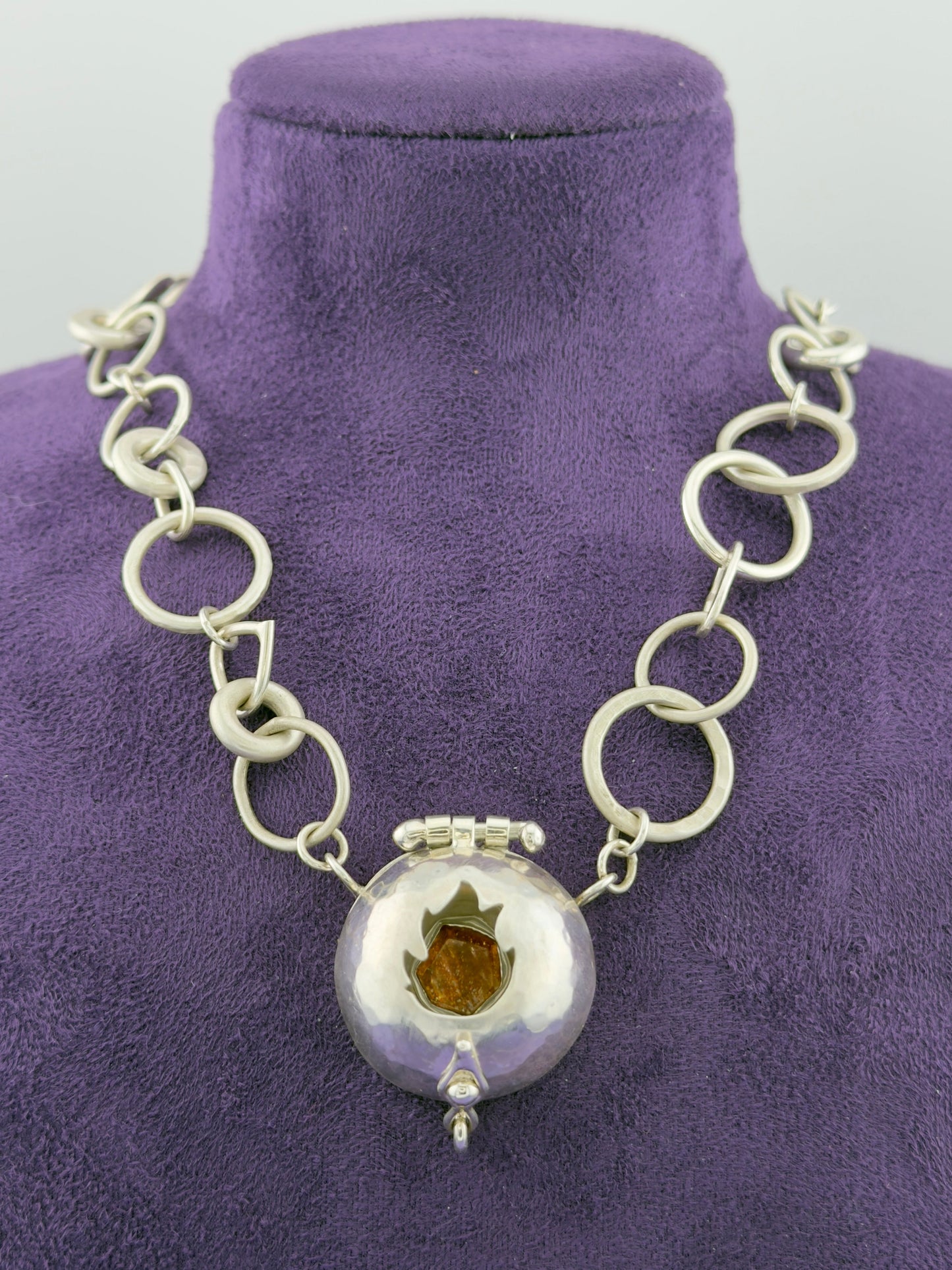 ‘The Fire Within’ necklace with flame cut out. Sun stone set