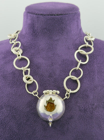 ‘The Fire Within’ necklace with flame cut out. Sun stone set
