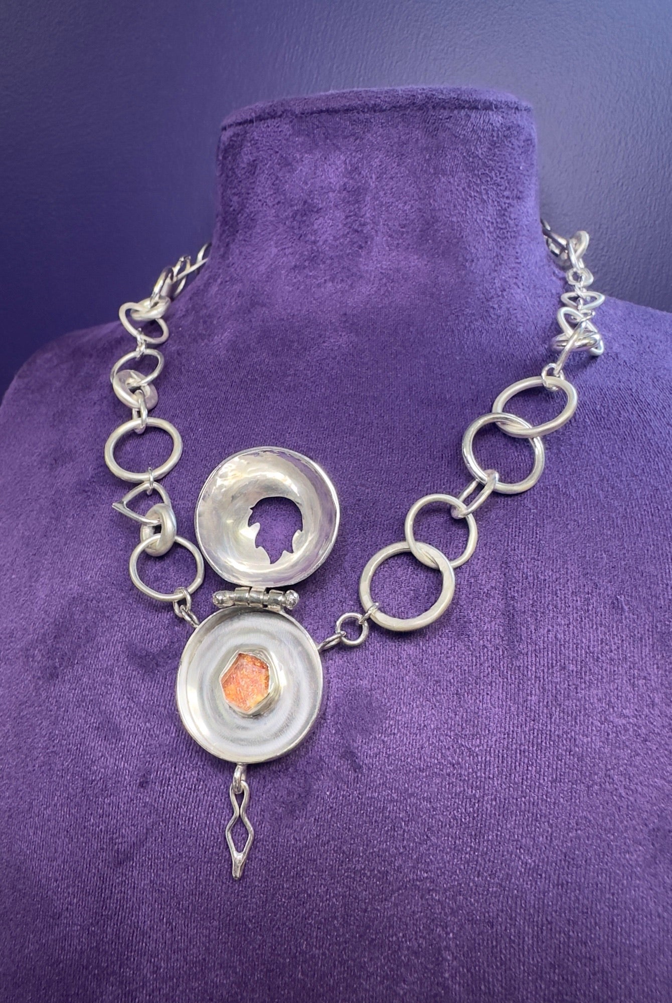 The Fire Within necklace with sunstone set in the centre of the locket