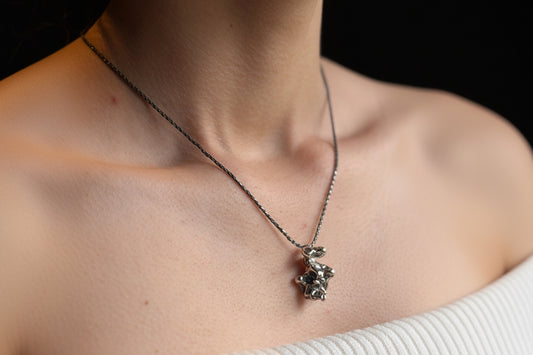 Alchemy pendant on model
