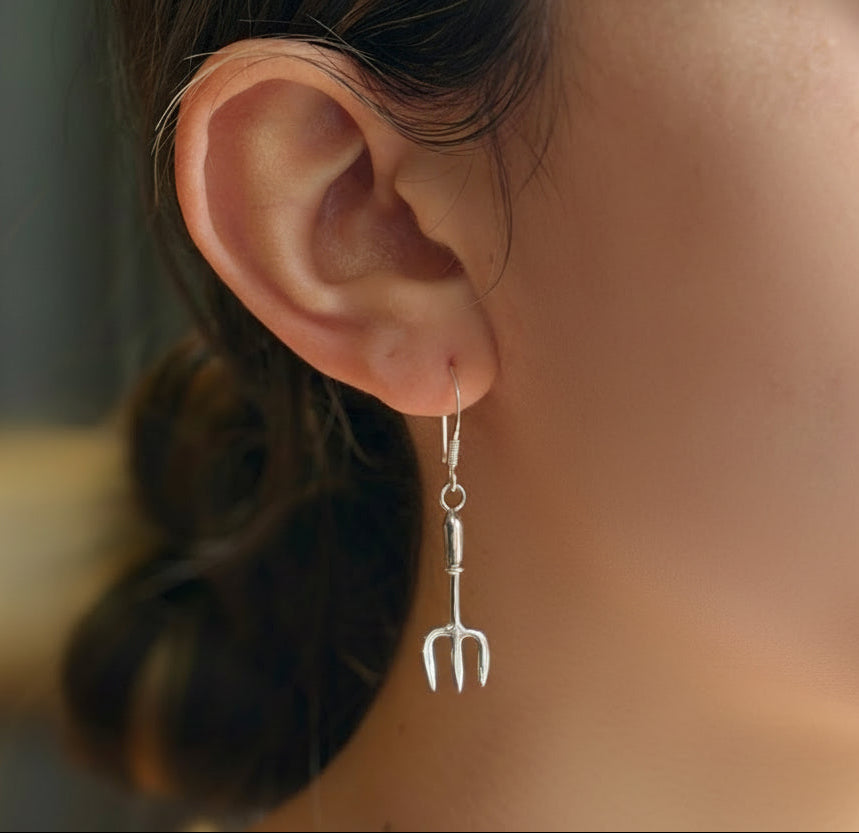 Girl earring on model’s ear
