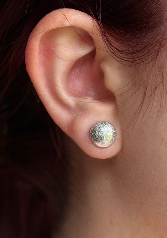 Rolled textured silver domed studs
