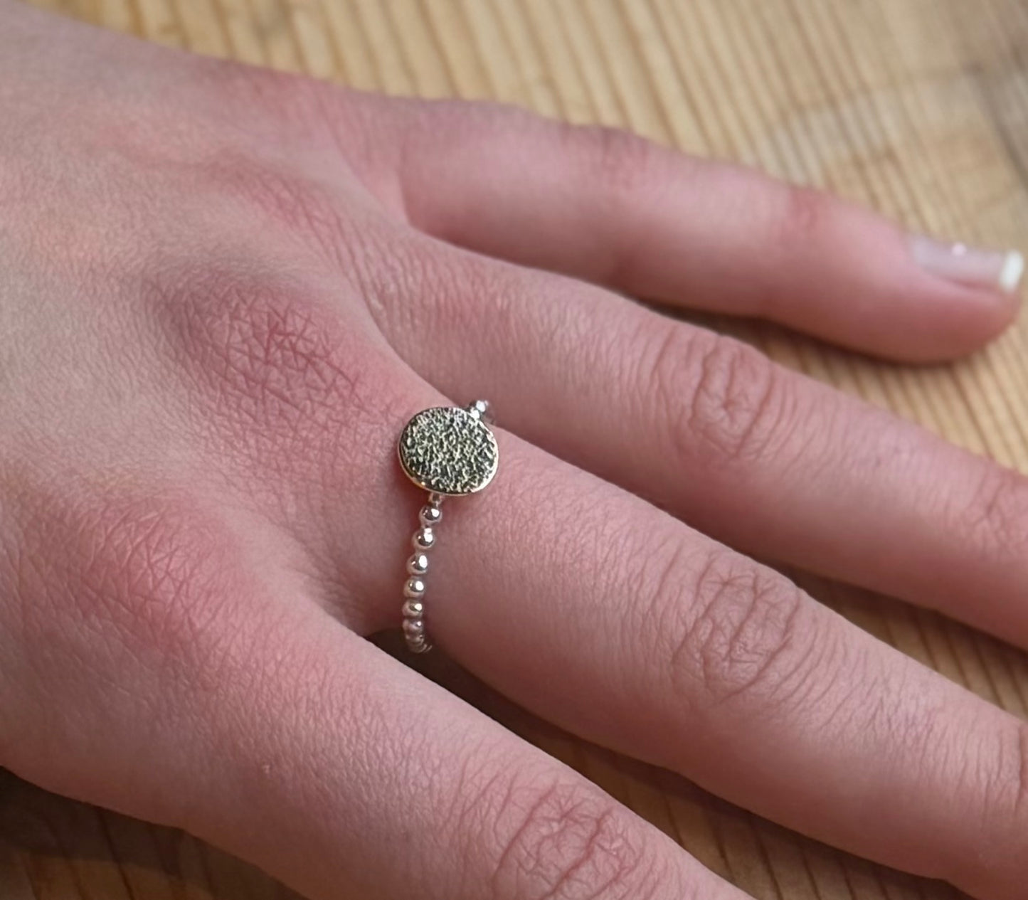 Beaded silver ring with 9ct yellow gold rolled textured disk - polished