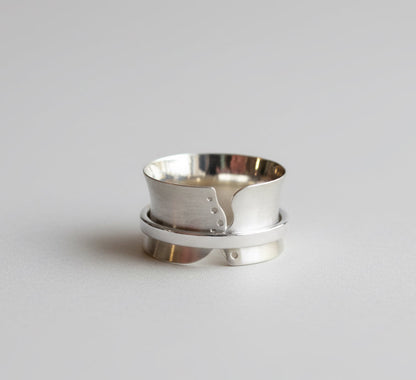 Silver spinner ring with cut outs