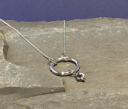 Silver molten drop ring necklace with carved recesses on the ring