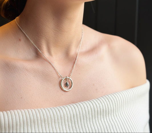 Silver molten drop ring necklace with carved recesses on the ring
