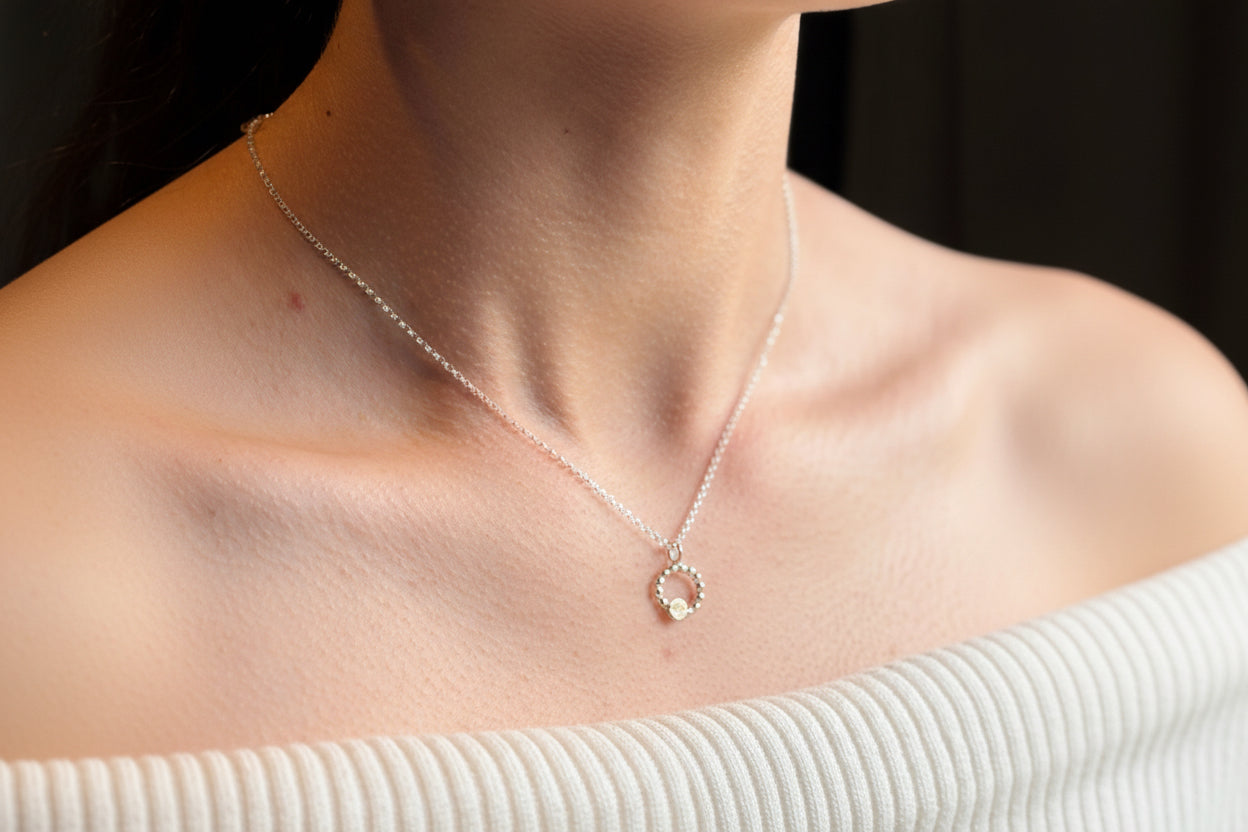 Beaded circle pendant with small textured 9ct yellow gold disc