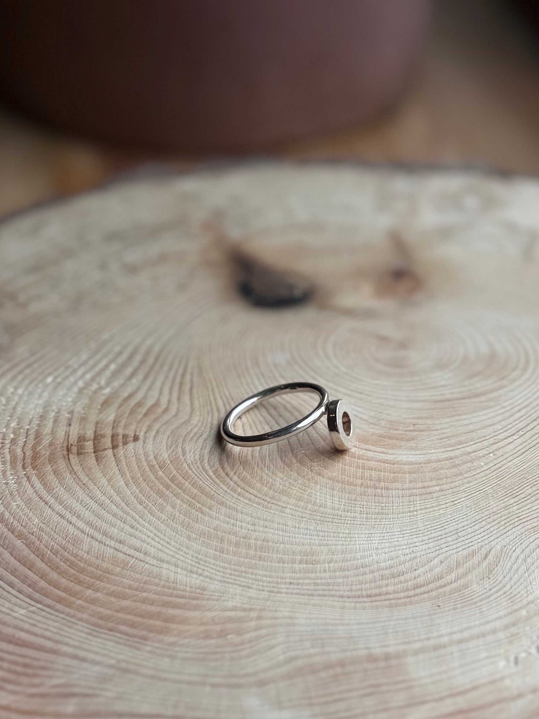 Silver ring band with donut shape, stacker style ring