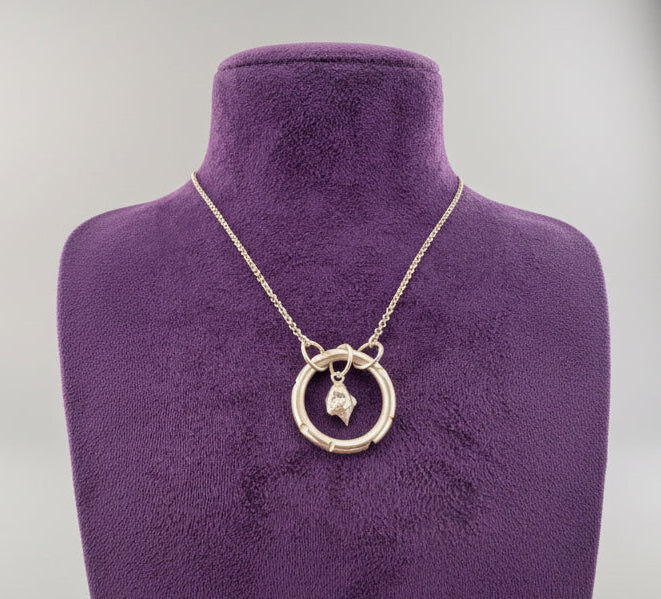 Alchemy pendant on purple bust