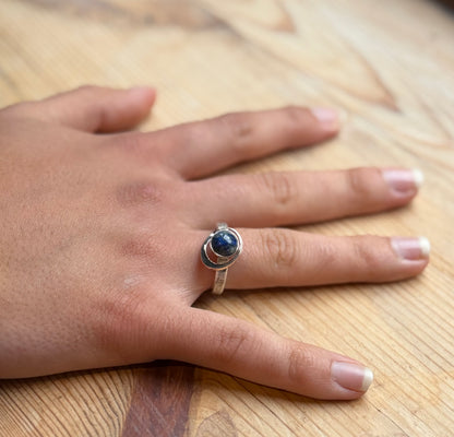 My World Is Rosy silver and 9 carat gold ring on hand