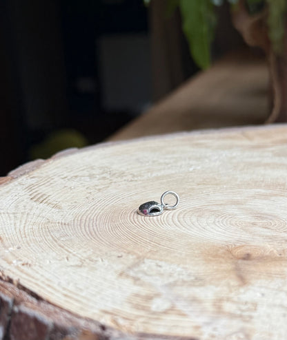 TTMAB charm on wood