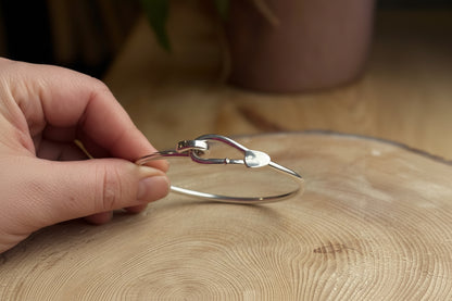 Bangle with trowel catch held on a wooden prop