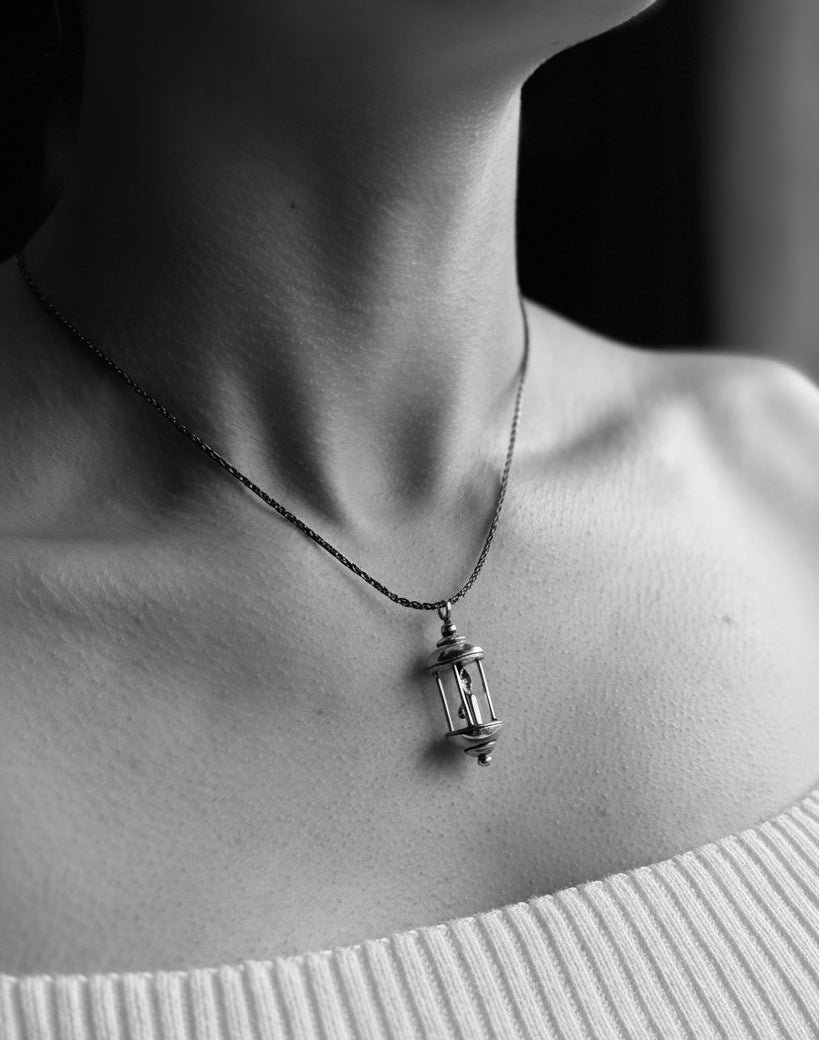Lantern pendant on model in black and white