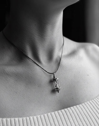 Lantern pendant on model in black and white