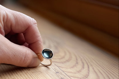 Thin band with domed oxidised disc