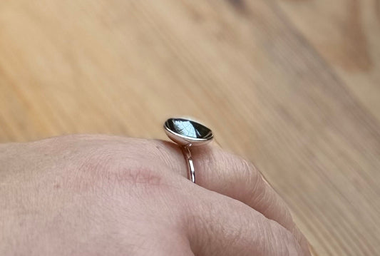 Silver ring with domed oxidised disc