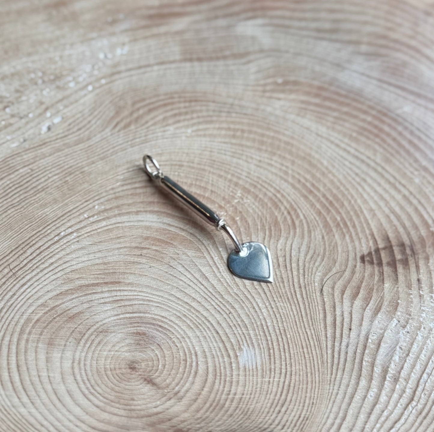 Old Dutch trowel charm on wood