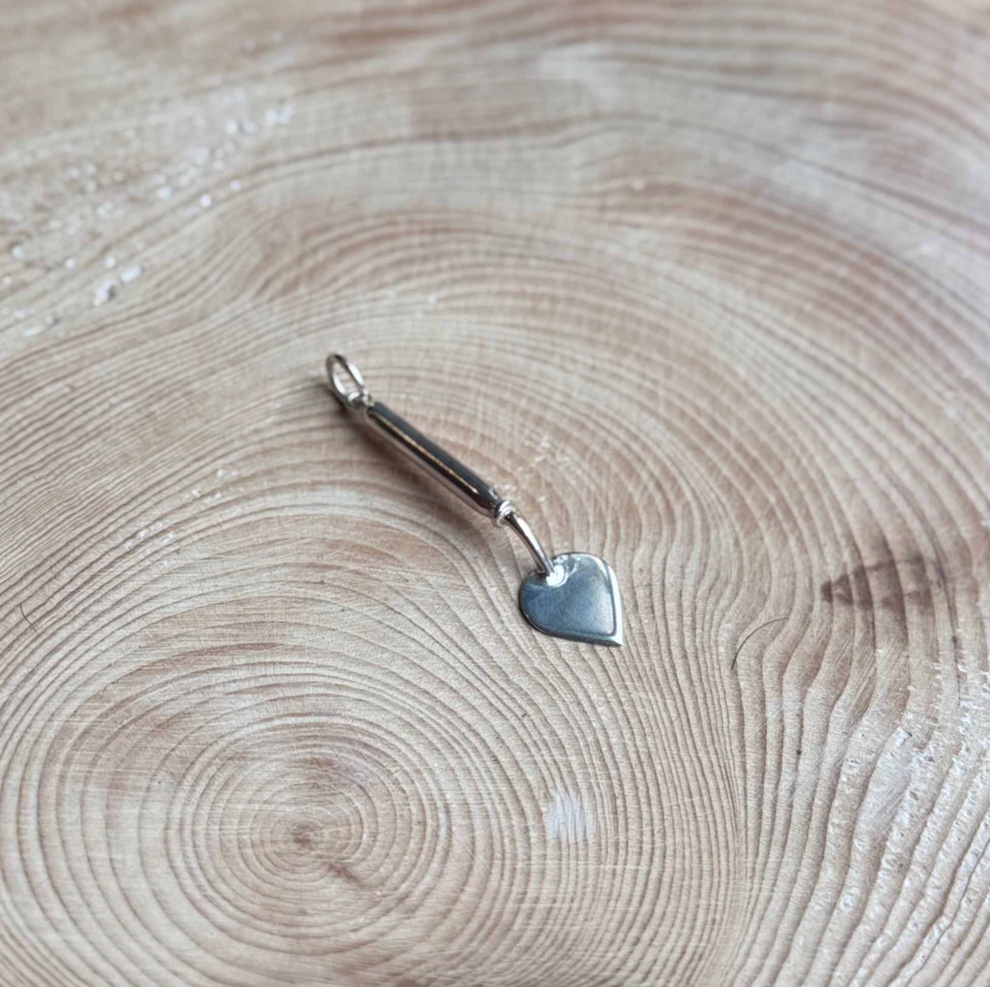 Old Dutch trowel charm on wood