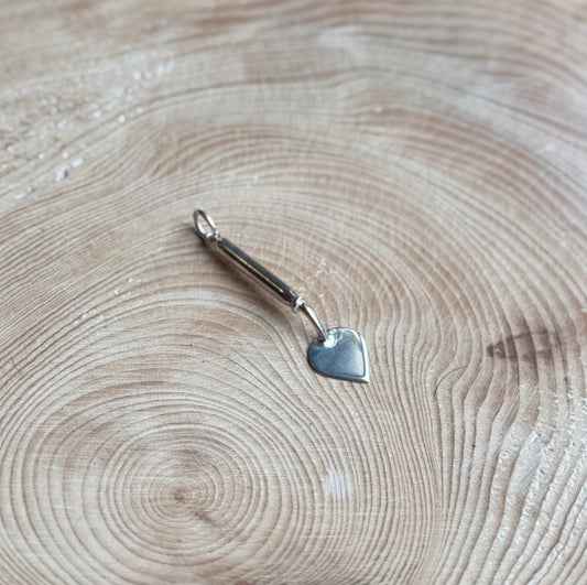 Old Dutch trowel charm on wood
