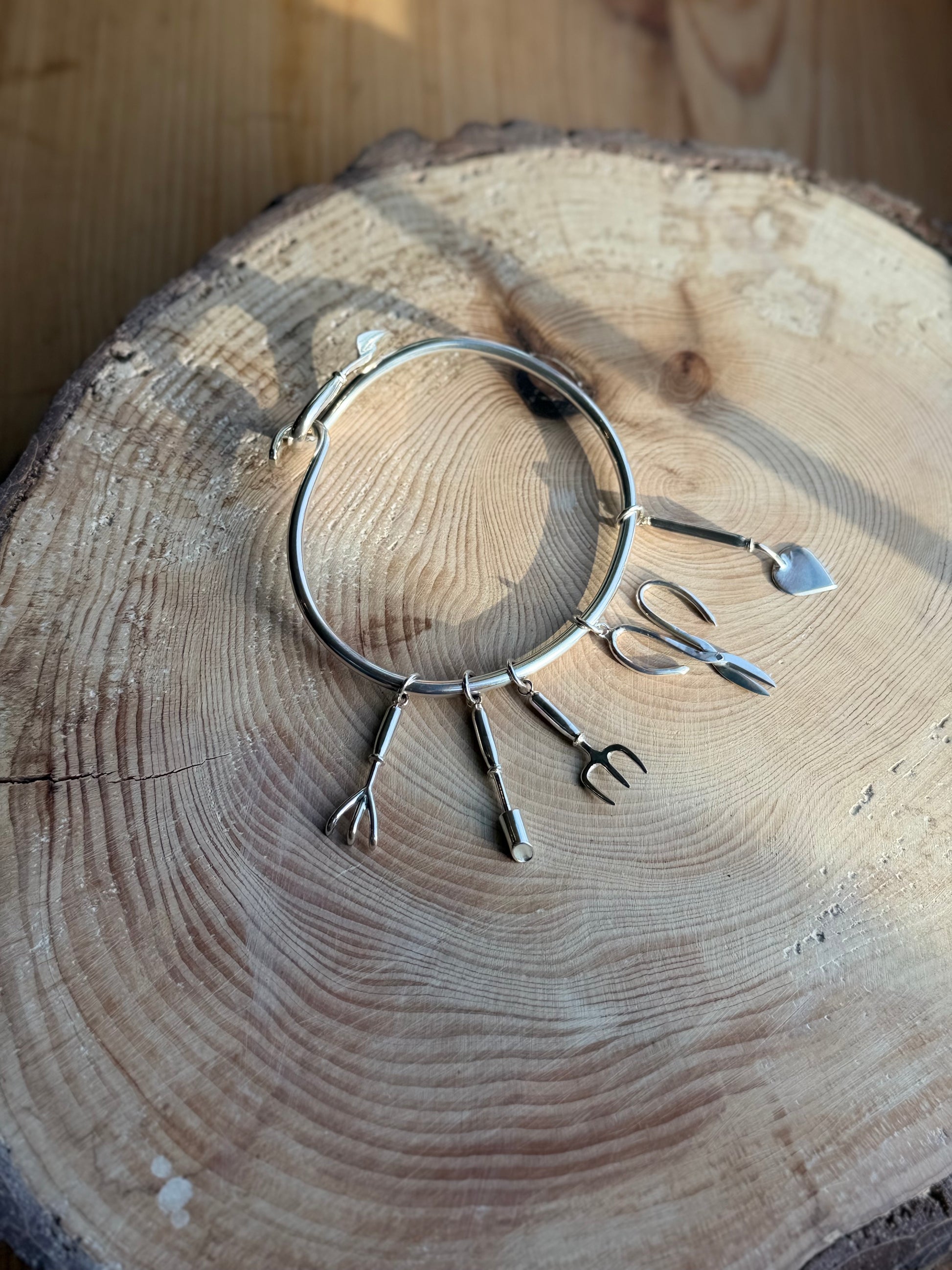 garden tool charms on bangle