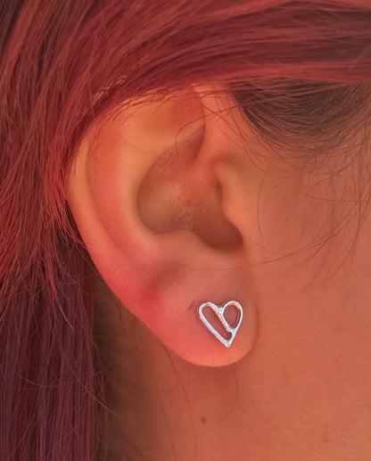 Silver stud on ear. Colour image