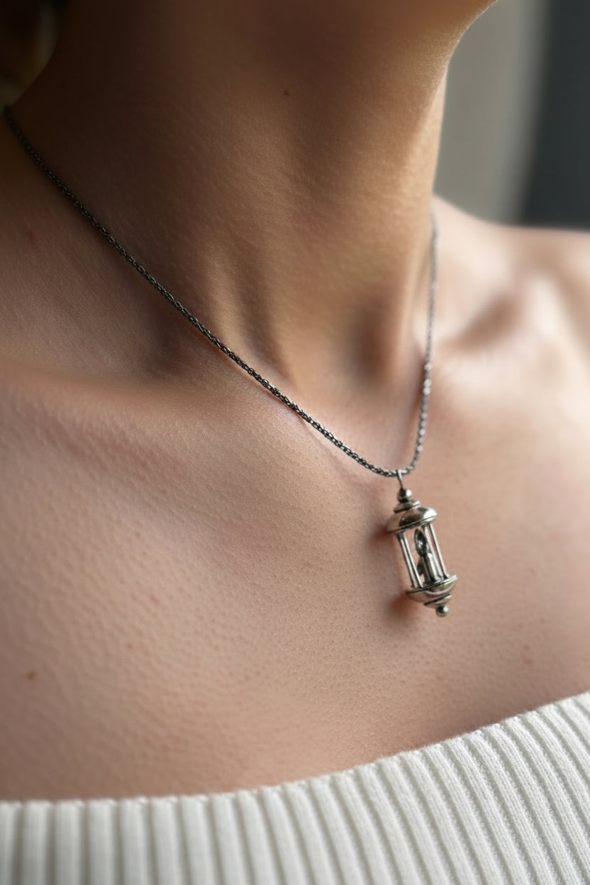 Lantern pendant with candle inside, burning, made in sterling silver