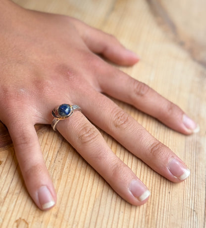 My World Is Rosy silver and 9 carat gold ring on hand