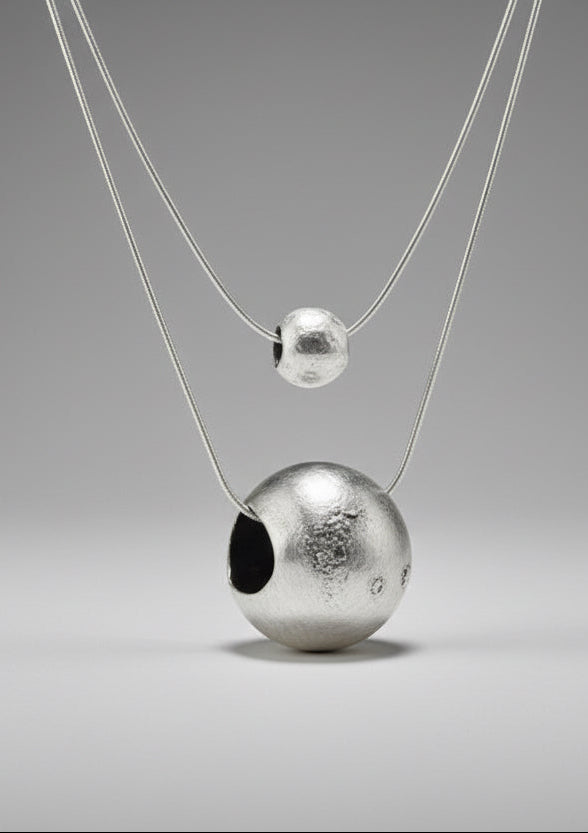 To the moon and back small and large necklaces on purple bust