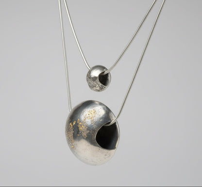 To the moon and back small and large necklaces in studio